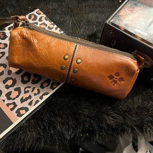 Used soft brown leather, pencil, make-up, jewelry case.